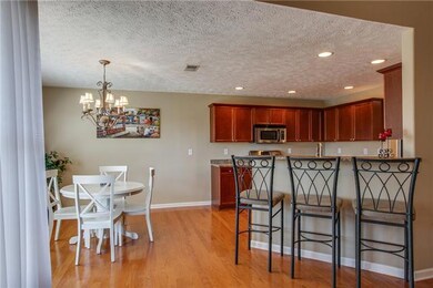 Plenty of seating in this kitchen with a sunny, eat-in area and a breakfast bar perfect for the mornings!