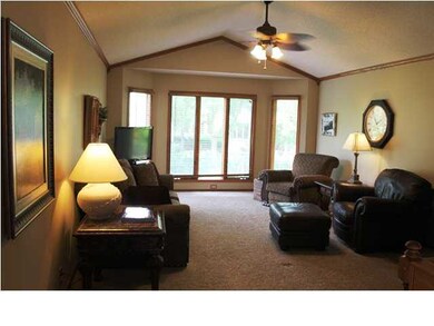 Spacious living room with vaulted ceiling.