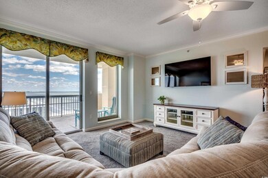 Living area featuring a textured ceiling, baseboar