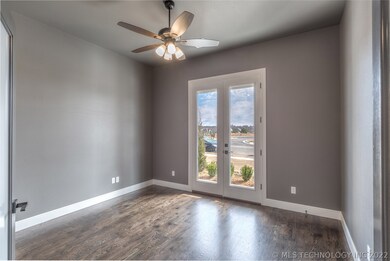 Study/den with hardwood floors, access to front pa