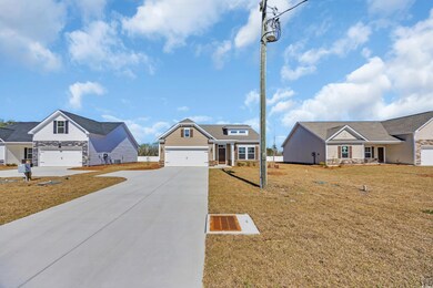 View of front of property featuring driveway and a