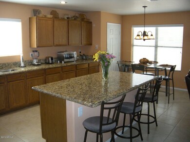 ISLAND KITCHEN WITH GRANITE COUNTERS