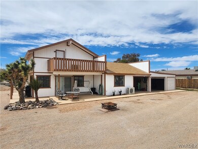 View of front of property with a garage with three