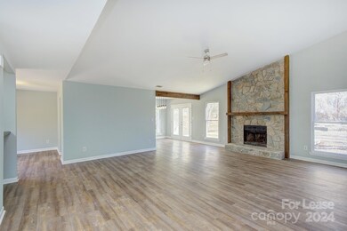 Valuted Ceilings with rock wood-burning fireplace!