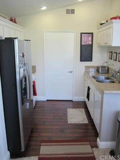KITCHEN AND DOOR TO LAUNDRY ROOM