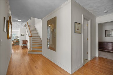 Generous Entryway with hardwood flooring.