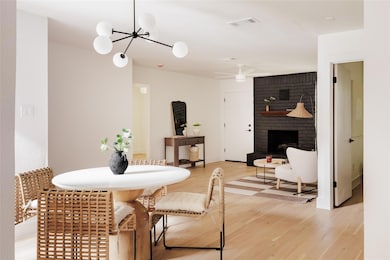 Dining room with light wood finished floors, a ch