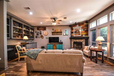 Living room featuring crown molding, fireplace, ex