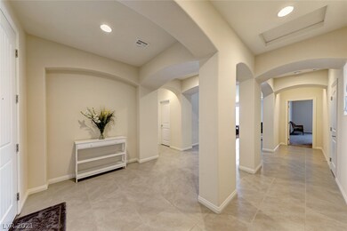 Foyer with ceramic tile floors throughout, carpet