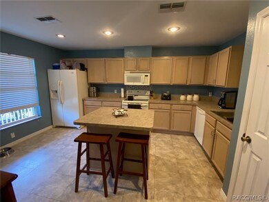 Island with seating and lots of cabinets