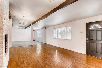 Living room w/ 2-way fire place...through to huge