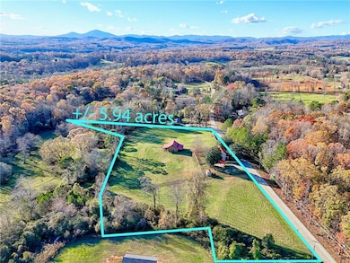 Drone / aerial view with a view of trees and a mountain view