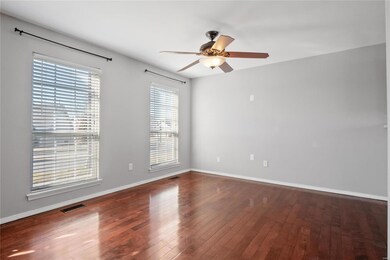 2 large windows and ceiling fan/light
