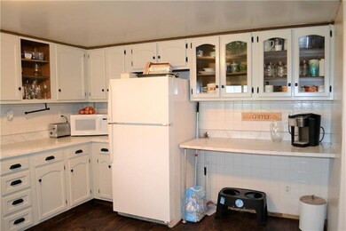 Bar for seating and cabinets to display your dishe