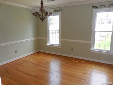 Freshly painted Dining Room with newer chandelier 