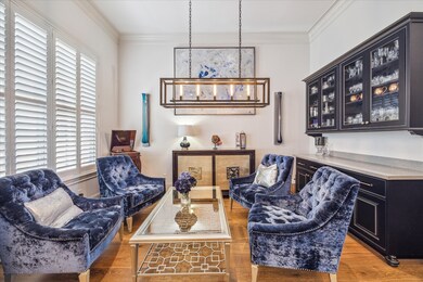 Dining room with dry bar used here as a sitting ar