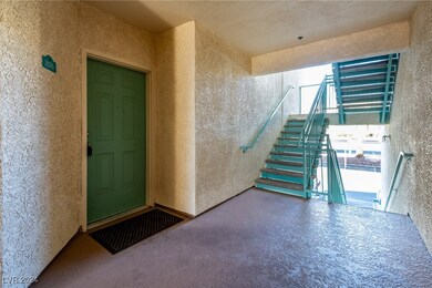 View of exterior entry with stucco siding