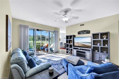 Tiled living room with a fireplace, a ceiling fan,