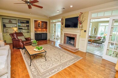 A cozy fireplace highlights the family-sized great