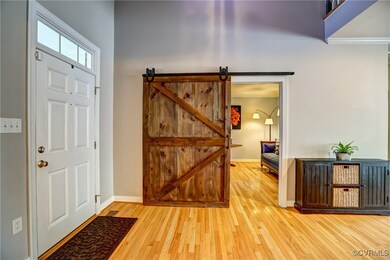 Soaring 2-story foyer with rustic-chic expression