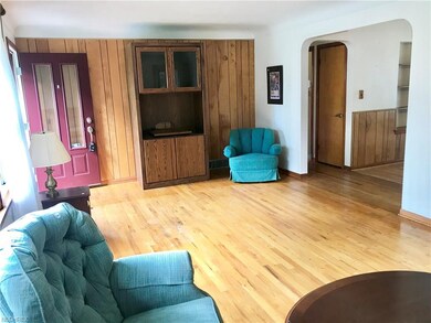 Large, light living room flows into eat-in kitchen