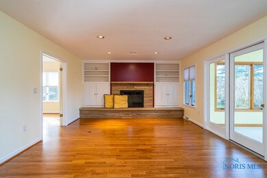 Family Room w/ stone FP, built-ins