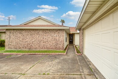 Front - long double wide driveway w/ 2 car attached garage