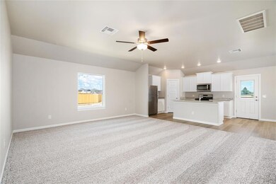 Spacious and bright, this open-concept living area