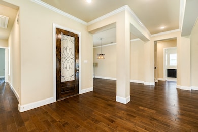 The hallway to the bedrooms, a formal dining room