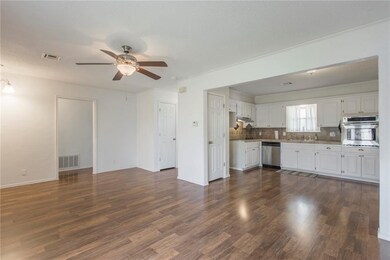 Spacious den and kitchen open concept.