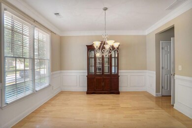 Upon entry, a separate dining room is located to the left, offering a dedicated space for meals and gatherings