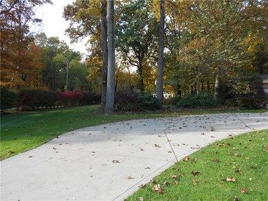 CONCRETE DRIVE TO HOME AND DETACHED 3 CAR GARAGE