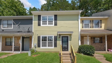 Multi unit property with brick siding and a front 