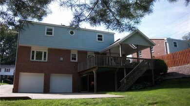 View from back yard.  Covered deck area off family