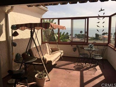 Glassed-in patio allows for a relaxed sheltered si