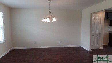 Formal dining room with entrances from the foyer a