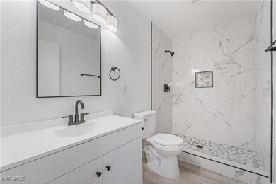 Full bathroom featuring a marble finish shower, to