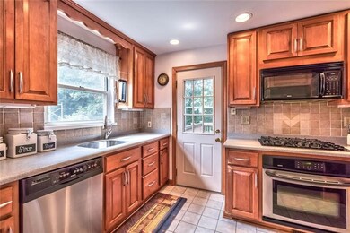 Updated kitchen with access to your new deck.