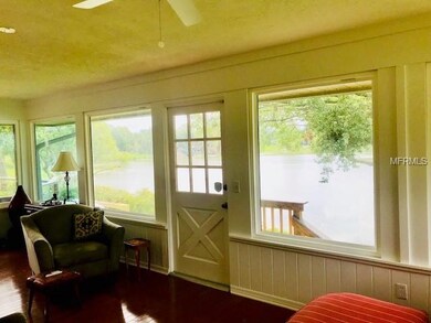 Large Florida room with panoramic lake views