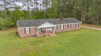 Ranch-style home featuring roof with shingles, a c