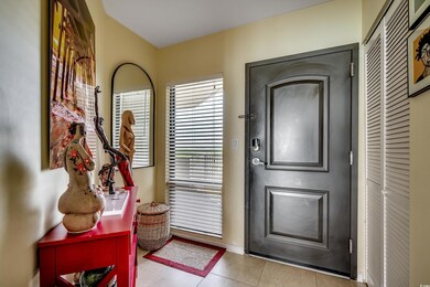 Foyer featuring tile patterned flooring and baseboards