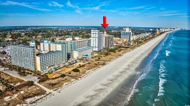 Birds eye view of property with a water view and a