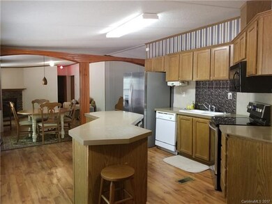 Kitchen view into Dining Area and Family Room