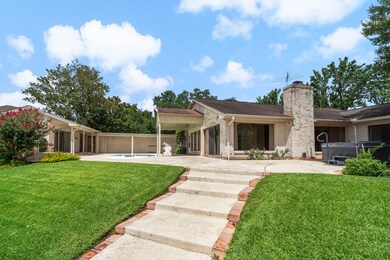 Perched high above the lake, the home offers stunn