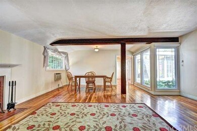 View from living room to dining room with a wall o