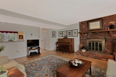 Family room with wood burning fireplace and kitche