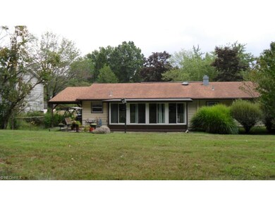 Relax on the back patio or sunroom all year long.