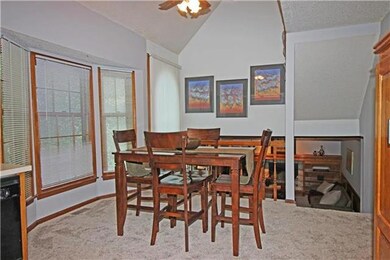 Informal Dining high ceilings and ceiling fan.