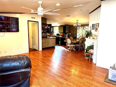 Living room featuring light wood-type flooring, ce