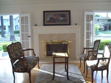 Formal living room with fireplace, hardwood floors
